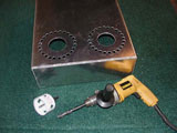 photo:  chassis with drilled holes for tube and tube cooling